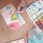 Participants work on their abstract geometric watercolour painting